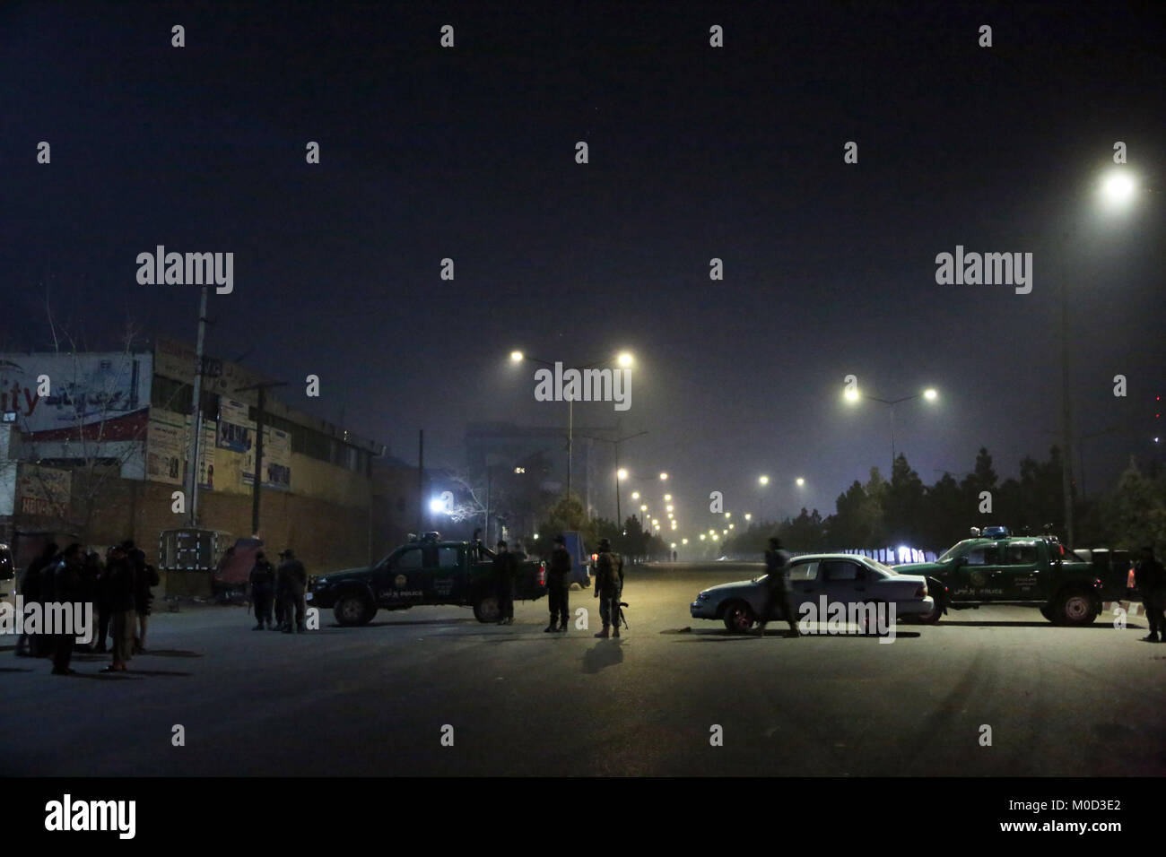 Kabul, Afghanistan. 20th Jan, 2018. Security personnel cordon off the street near Kabul's Intercontinental Hotel in Kabul, Afghanistan, on Jan. 20, 2018. At least one attacker and several civilians were killed as a counter-attack was underway in Kabul's Intercontinental Hotel Saturday night following a terror attack there, a source said. Credit: Rahmat Alizadah/Xinhua/Alamy Live News Stock Photo