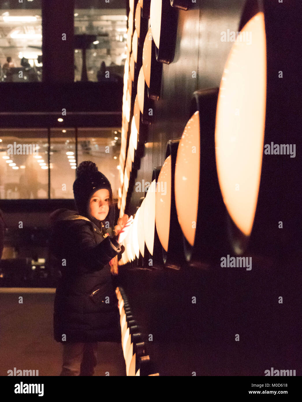 London, England, UK. 20th Jan, 2018. Kid girl dancing next to light