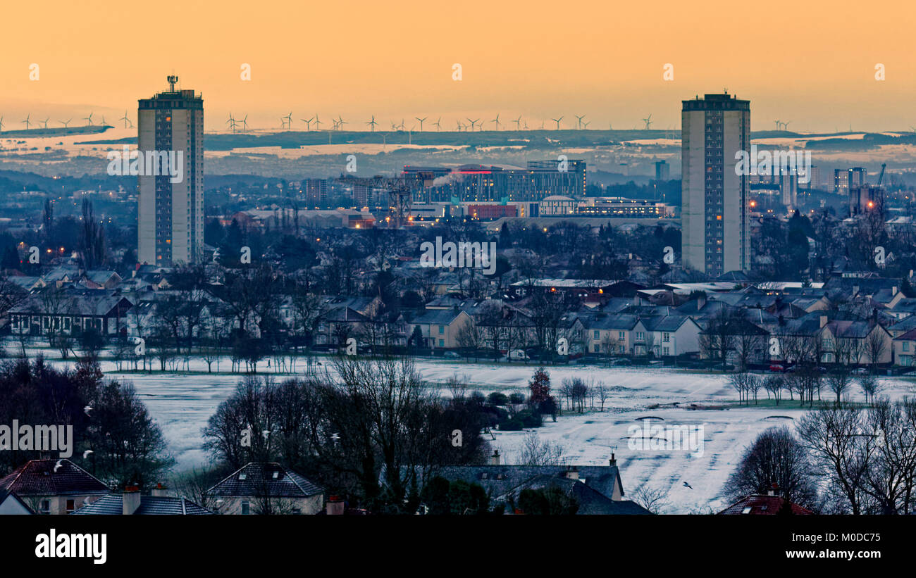 Glasgow, Scotland, UK 21st January.UK Weather: Overnight snow with freezing temperatures gives a colourful dawn over the queen Elizabeth university hospital and the scotstoun towers to the city. Credit Gerard Ferry/Alamy news Stock Photo
