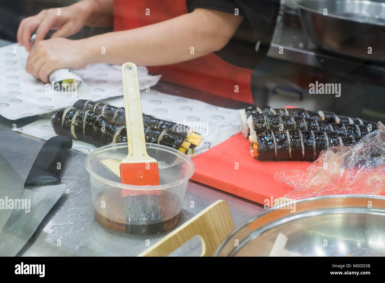 Woman preparing Kimbap rice roll Stock Photo