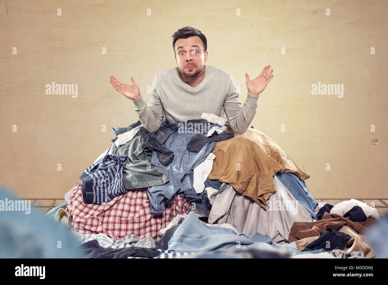 Man overstrained with housekeeping Stock Photo