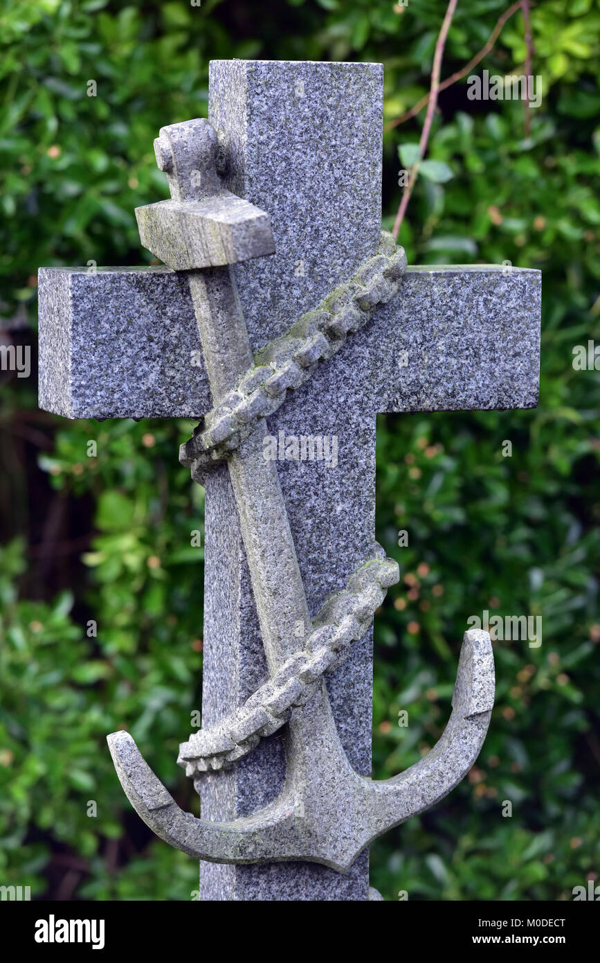 a fouled anchor made of stone and used as a headstone in a cemetery or