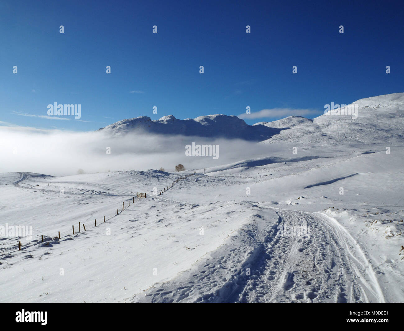 Cloud inversion above Kingussie in the Scottish Highlands, as motorists are being urged to be wary of ice on the roads after disruption in areas hit by snow this week. Stock Photo