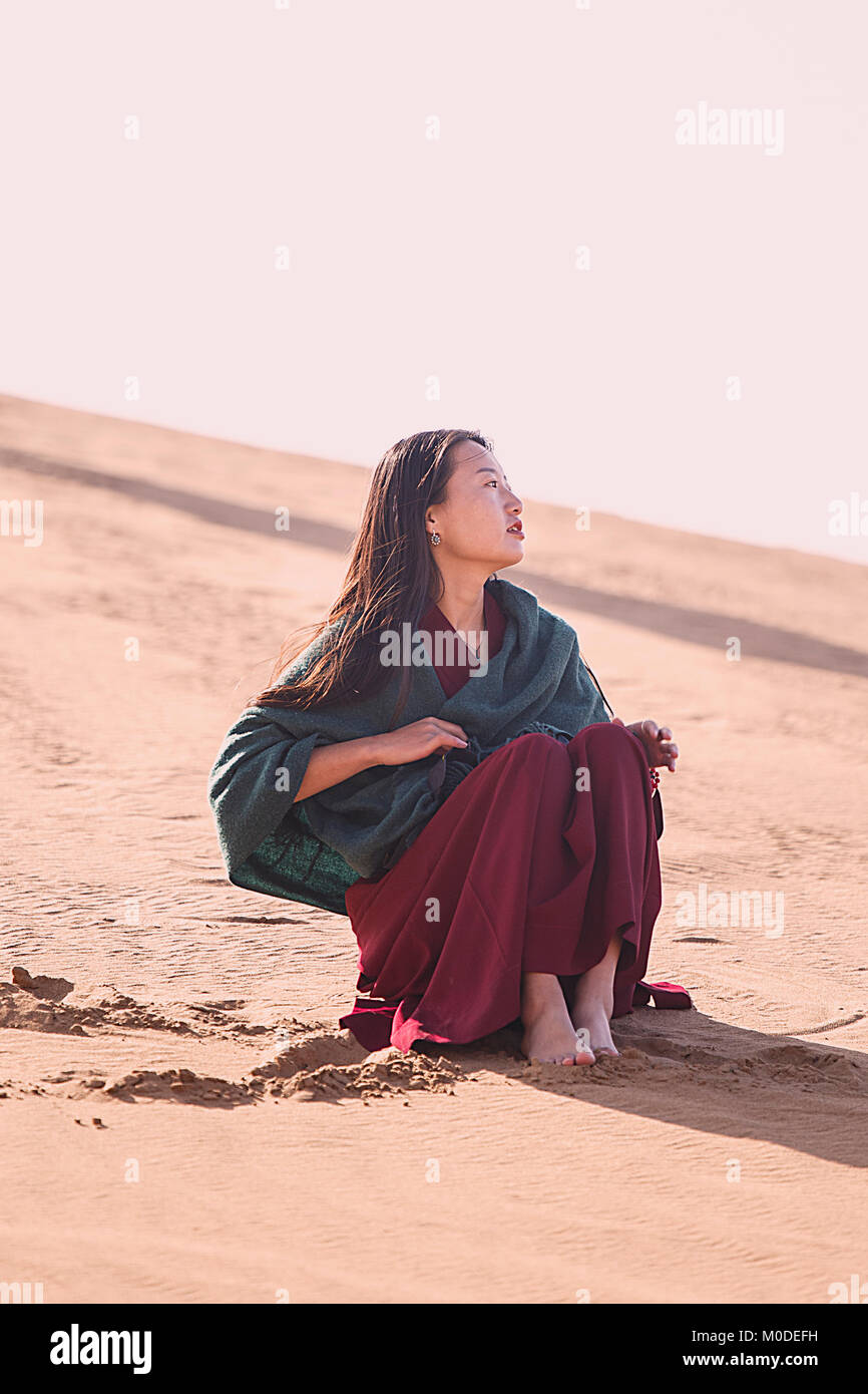 Badain Jaran,China - October 19,2017: Chinese woman photographs the desert of Badain Jaran. Stock Photo