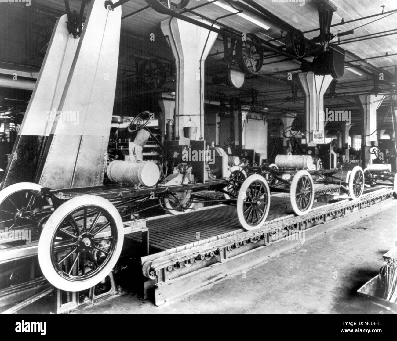 The Model T Ford production line at the  Ford Motor Company's Highland Park plant in 1913. Stock Photo