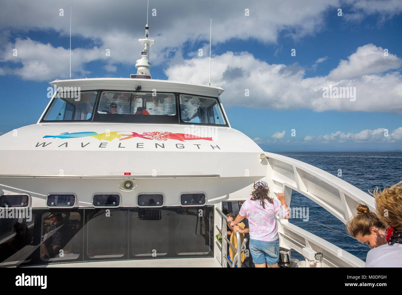 Wavelength tour boat taking people to the Great Barrier reef in Queensland,Australia Stock Photo