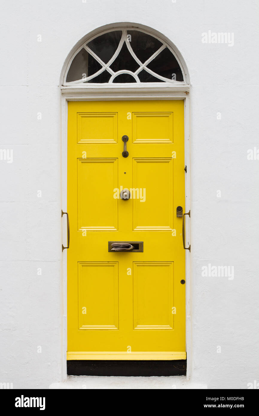 Front View Of Yellow Elegant Residential Apartment Door With Glass