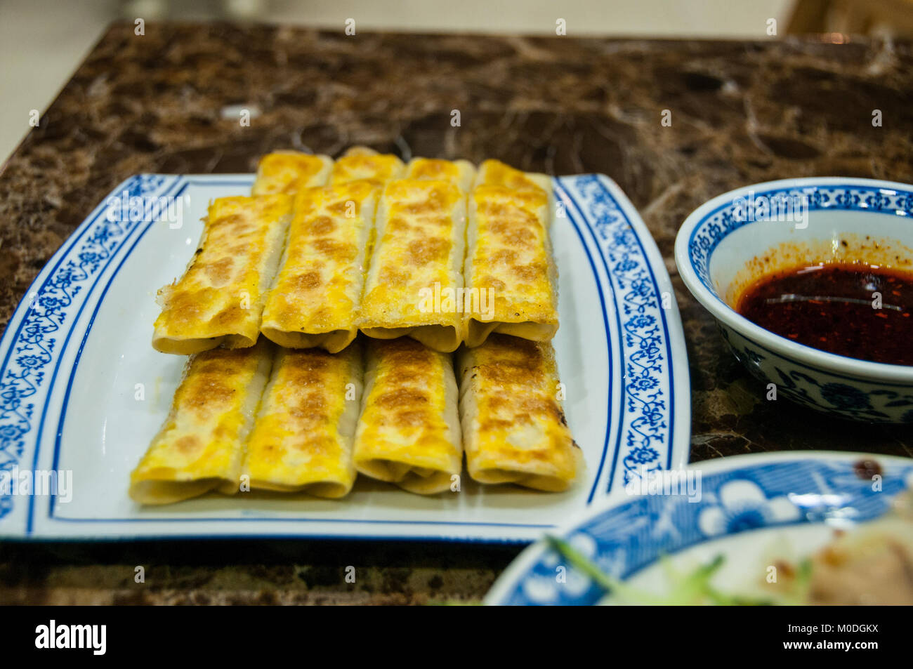 A plate of Xi’an style pot stickers (guo tie) a kind of fried dumpling