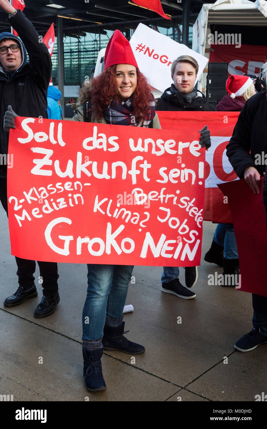 Bonn, Germany. 21 January 2018. Members of the SPD youth organisation Jusos (Young Socialists) protest against a grand coalition outside the event venue. SPD extraordinary party convention at World Conference Center Bonn to discuss and approve options to enter into a grand coalition with Angela Merkel's CDU, Christian Democrats, before asking SPD members for approval. Stock Photo