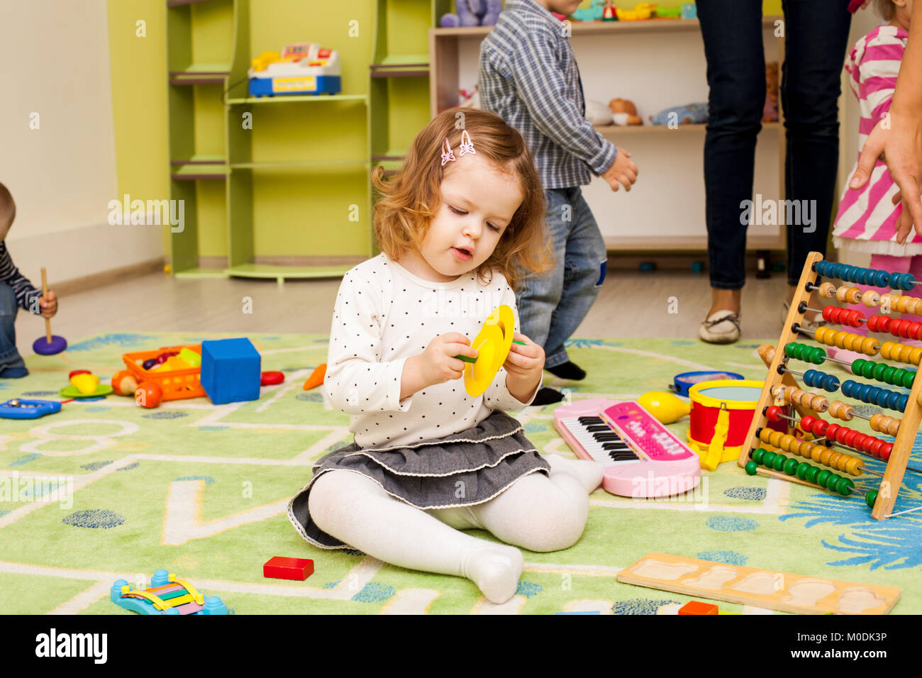 Kids playing with toys Stock Photo Alamy