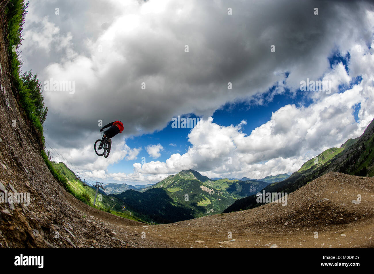Mountain biker Vincent Tupin jumps in Chatel Bike Park in the French