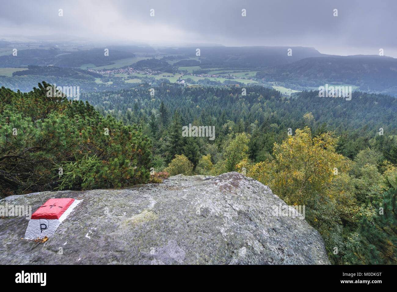 Polish-Czech border next to Bledne Skaly trail in Stolowe Mountains range, part of Sudetes, Poland. Machow town in Czech Republic on background Stock Photo