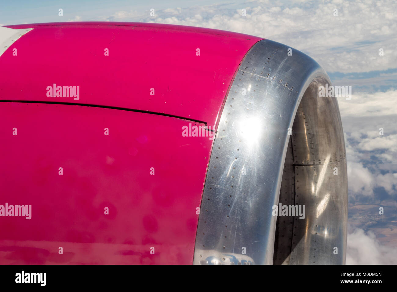 Flight Engine Side View Engine of passenger airplane - sideview close up with clouds in ...