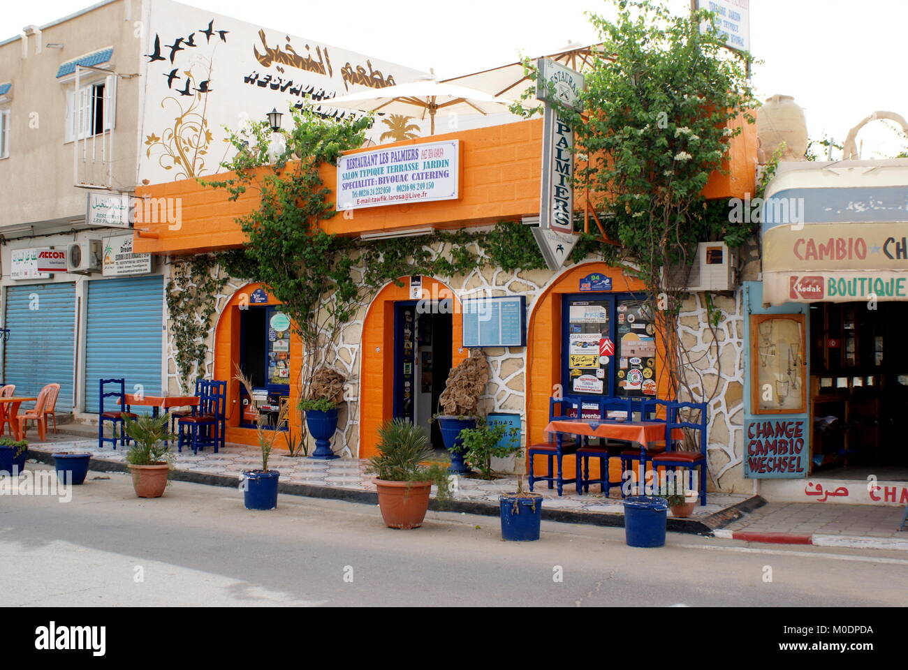 Colourful orange and blue restaurant in Douz, Tunisia Stock Photo