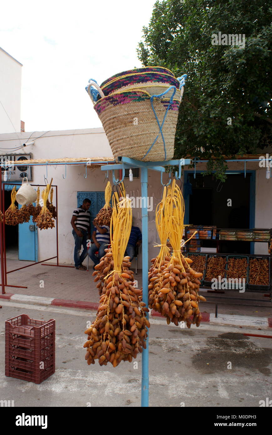 Dates and hand woven palm leaf baskets for sale, Douz, Tunisia Stock Photo