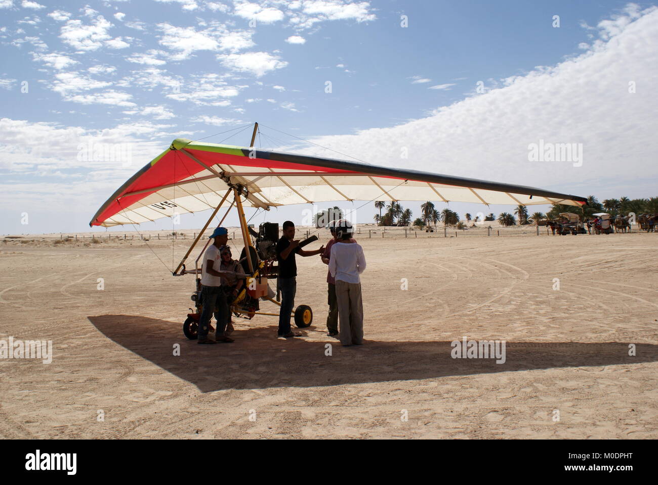 Receiving instructions before going up in a Microlight plane over the Sahara desert, Douz, Kebili district, Tunisia Stock Photo