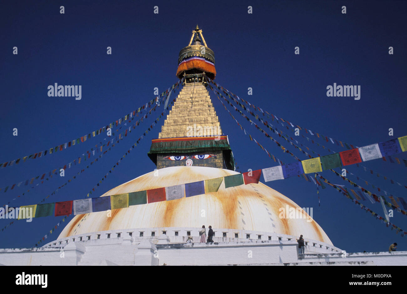 Nepal, Kathmandu. Bodnath temple, stupa (Buddhism). People walking. Stock Photo