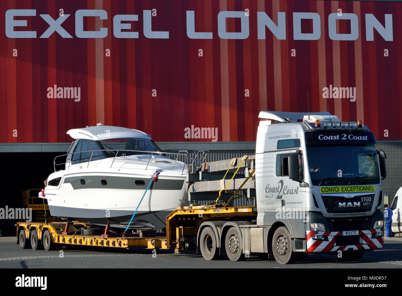 Lorry transporting a boat back to it's home port after they have attended the 2018 London Boat Show held at ExCel London exhibition centre Stock Photo