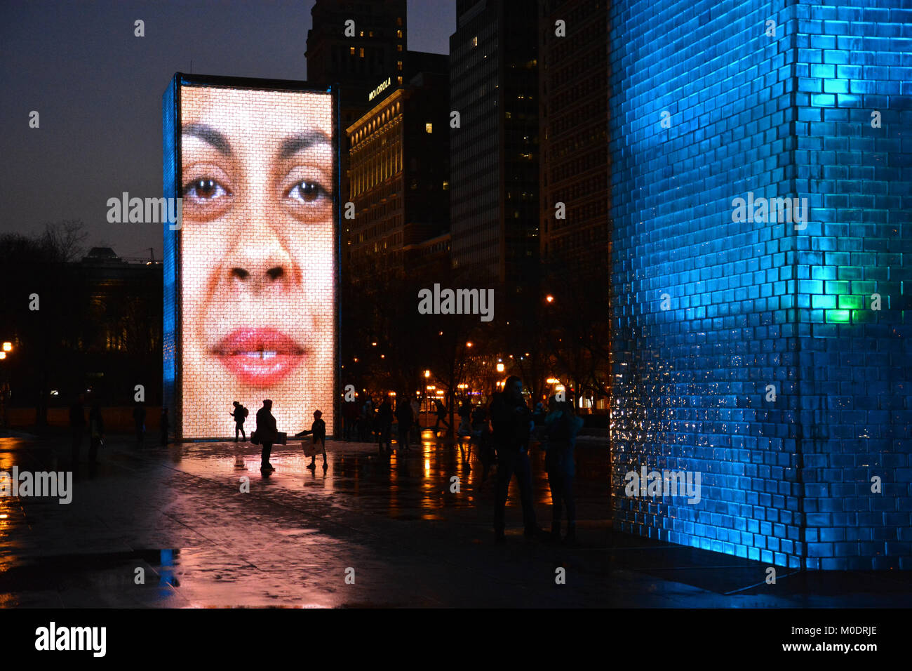 The faces on the glass block Crown Fountains entertain visitors in Chicago's Millennium Park. Stock Photo