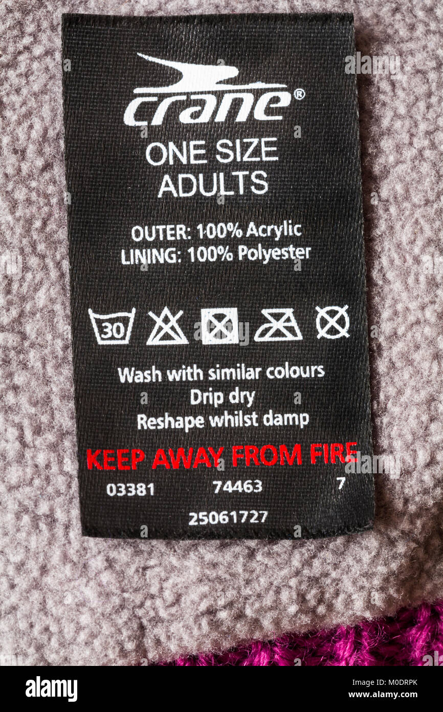 crane one size adults label in hat - outer 100% acrylic lining 100% polyester keep away from fire with wash care instructions and symbols Stock Photo