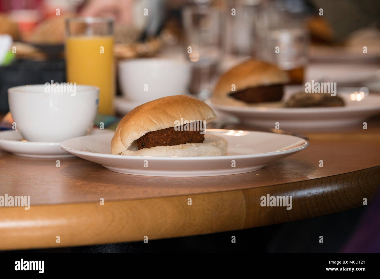 snack croquette on bread during lunch, this is a typical dutch fast food snack Stock Photo