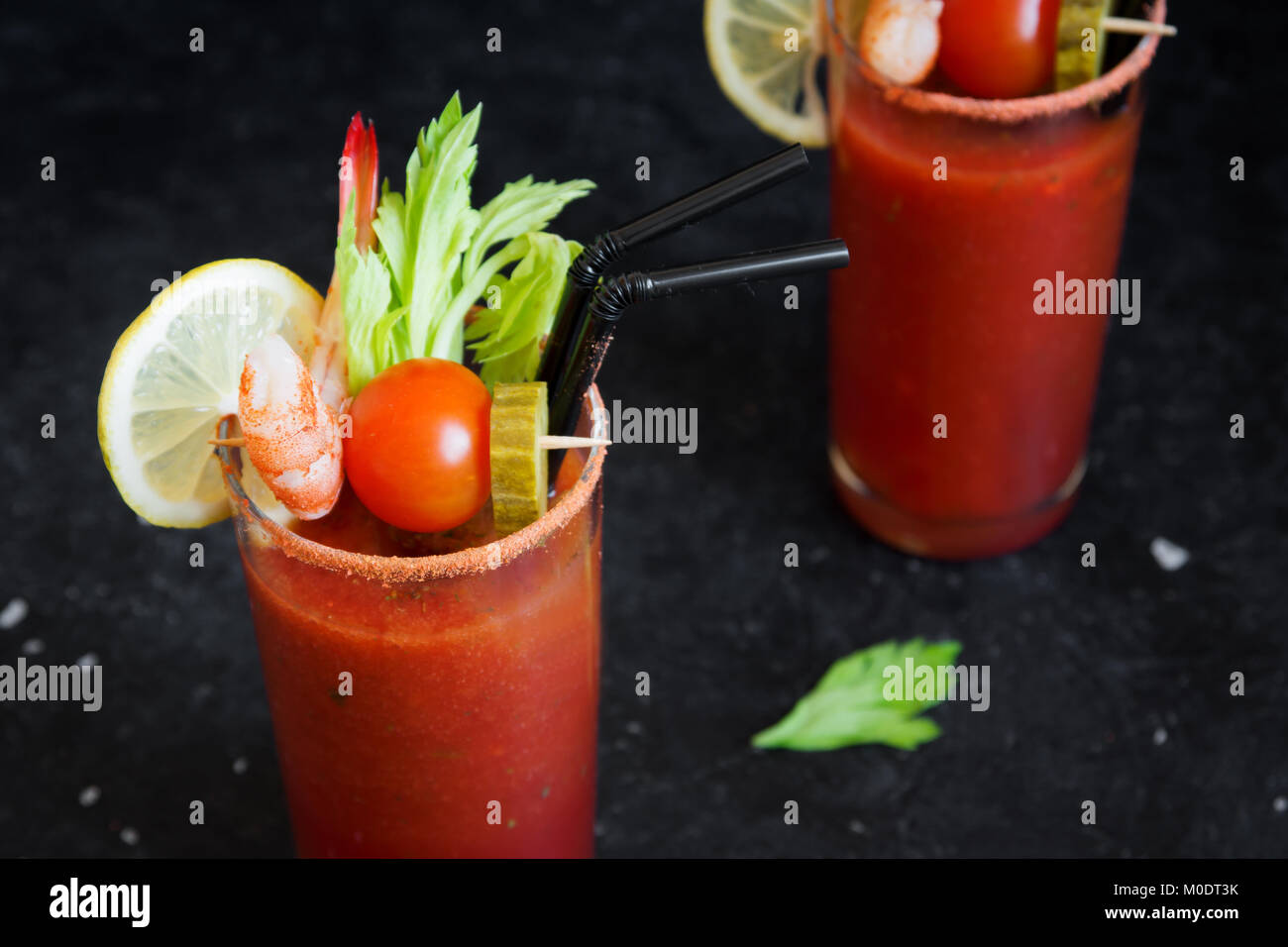 https://c8.alamy.com/comp/M0DT3K/bloody-mary-cocktail-in-glasses-with-garnishes-tomato-bloody-mary-M0DT3K.jpg