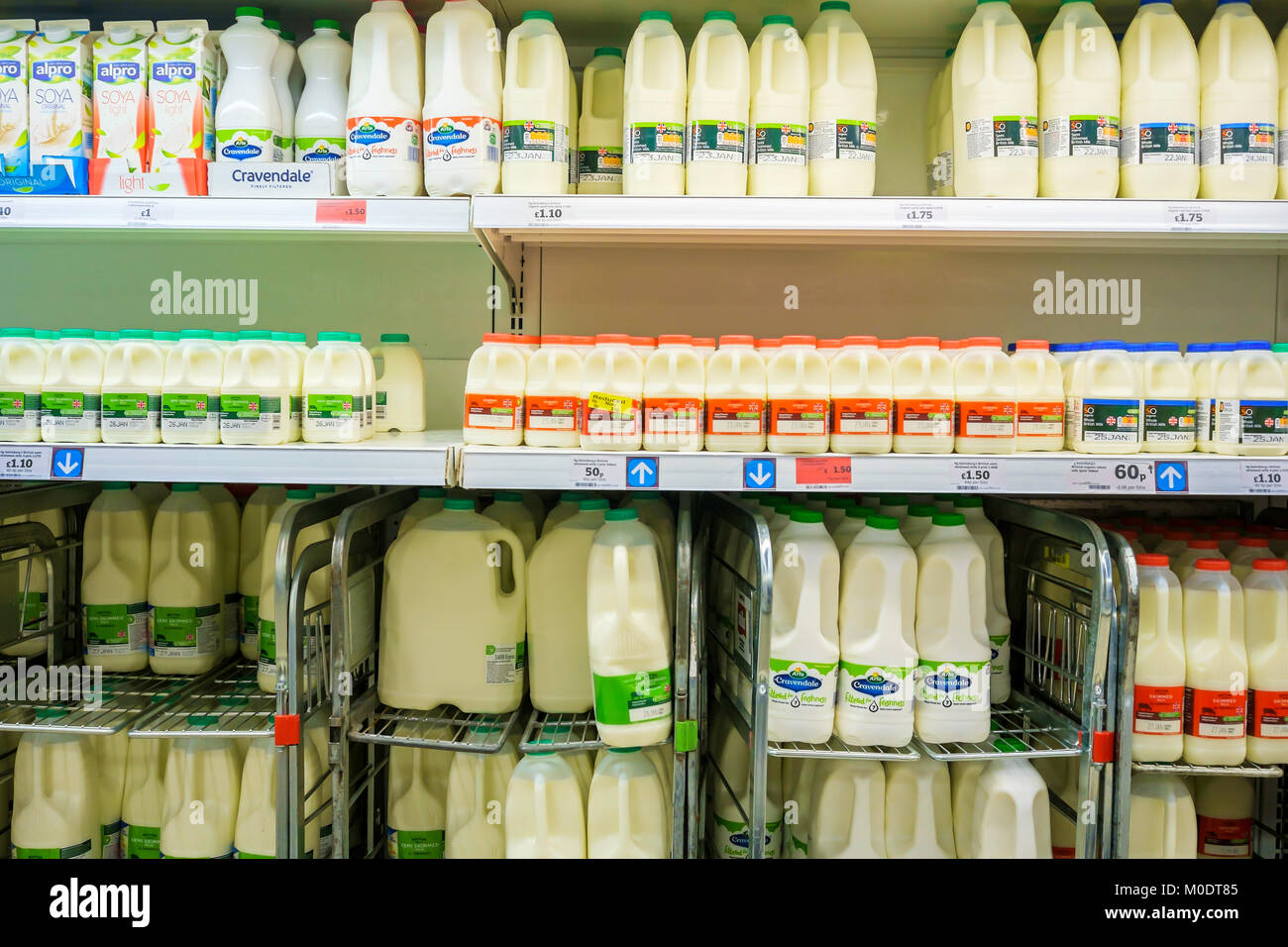Supermarket display of various types of milk and milk products Stock Photo
