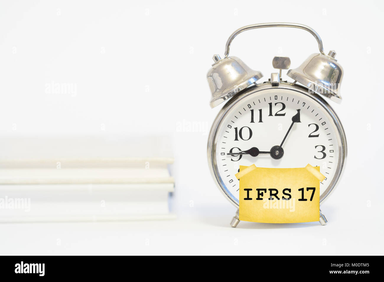 ifrs 17 insurance accounting standard concept with alarm clock Stock Photo
