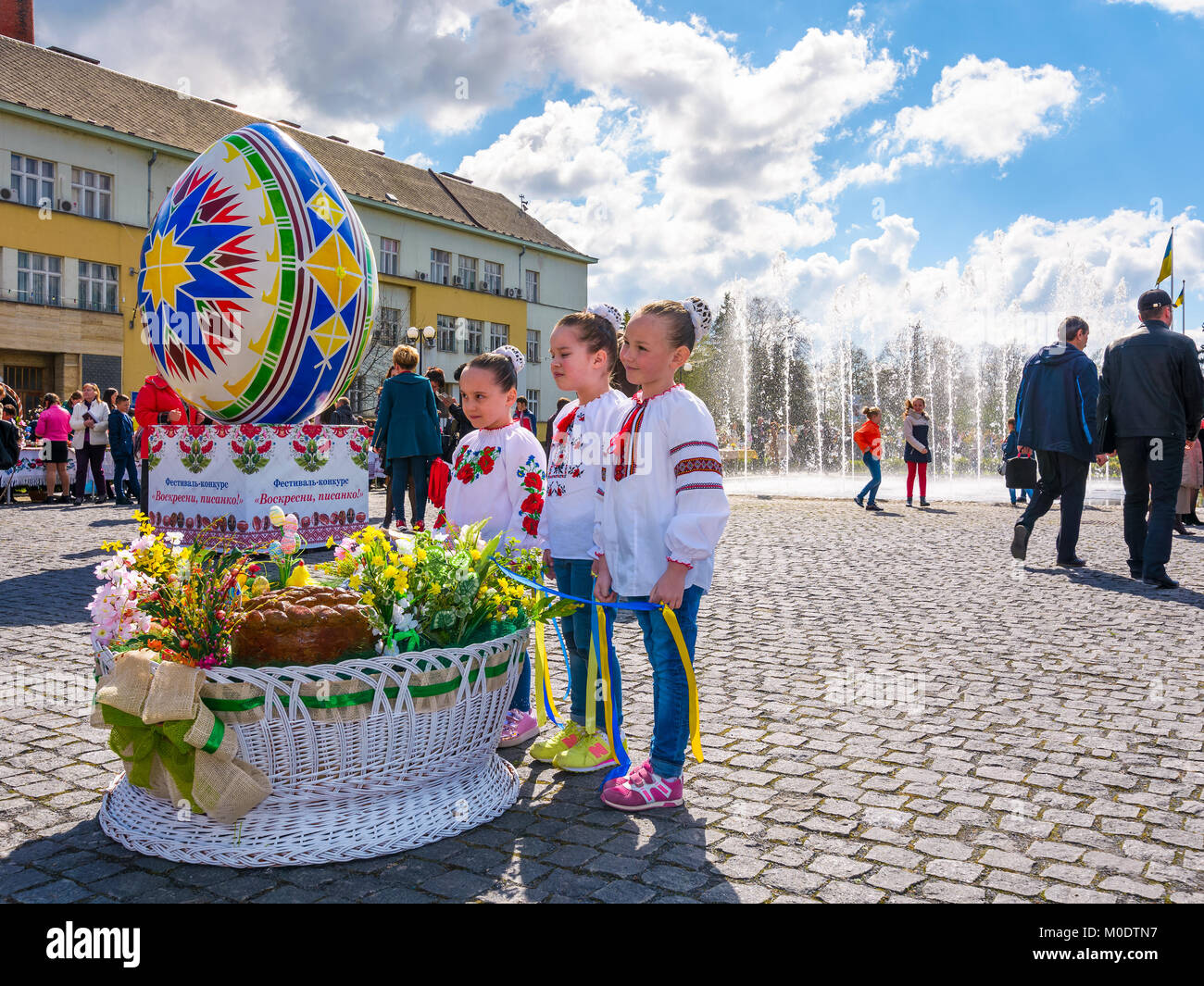 Uzhgorod, Ukraine - April 07, 2017: Celebrating Orthodox Easter in Uzhgorod on the Narodna square. Huge egg near the fountain on a warm springtime day Stock Photo