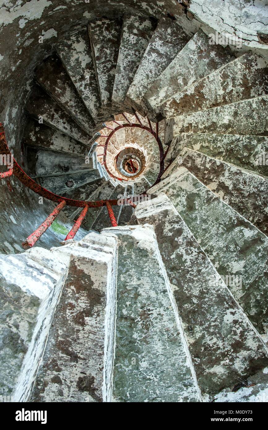 The ladder in the old abandoned lighthouse. Russia Stock Photo