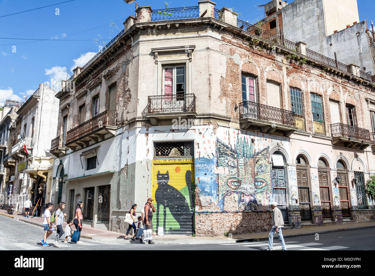 Buenos Aires Argentina,San Telmo,historic center,building,dilapidated,mural,street art,graffiti,corner,pedestrian,Black cat,Hispanic ARG171119334 Stock Photo