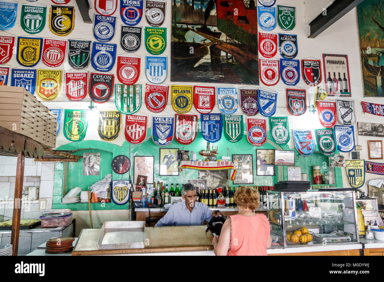 Buenos Aires Argentina,San Telmo,historic district,Bar Pedro Telmo,local pub,sports bar,sports team logos,counter,man men male,woman female women,Hisp Stock Photo