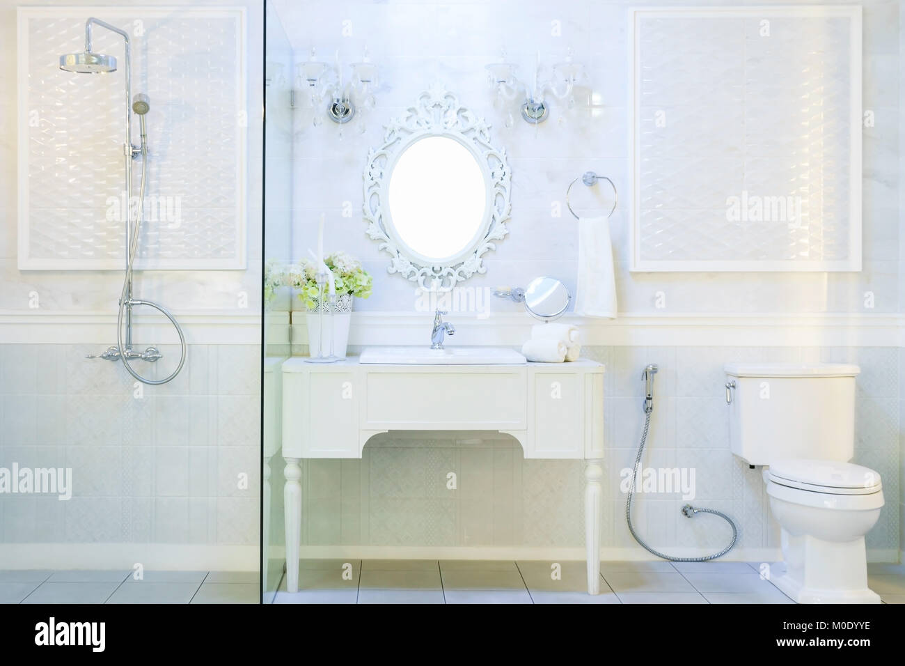 Spacious and bright modern bathroom interior with white walls, a shower ...