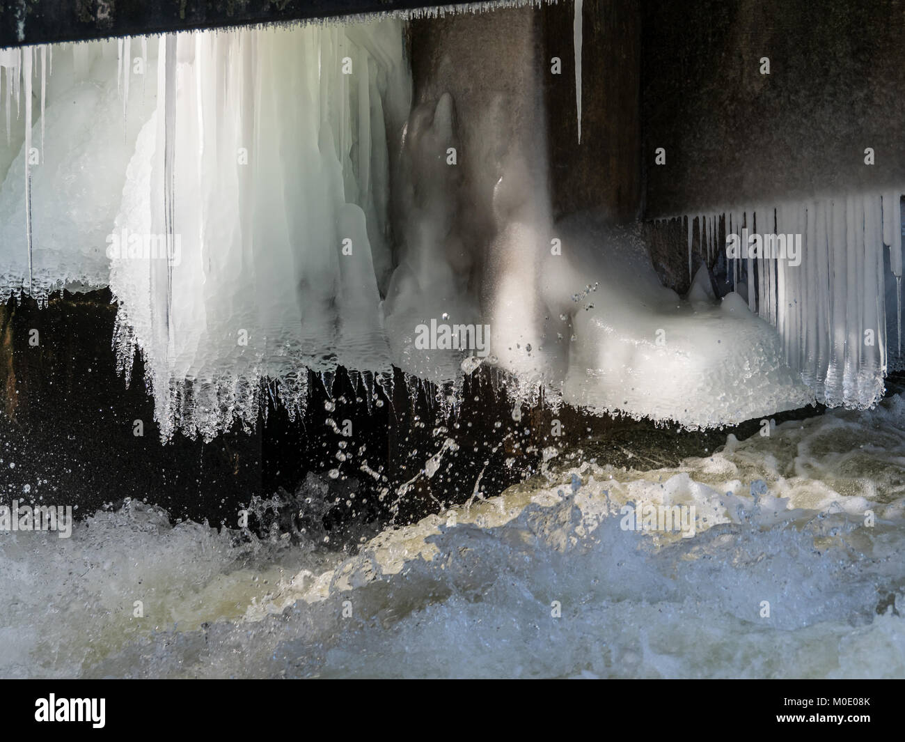 Icicles and Running Water Stock Photo