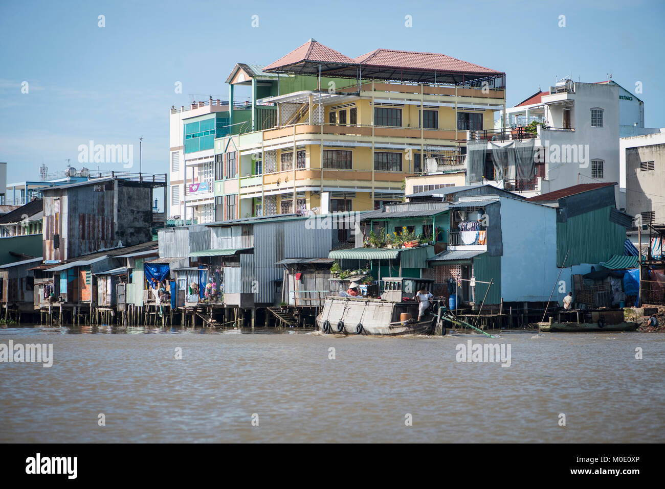 River-side housing, Mekong delta, Vietnam Stock Photo