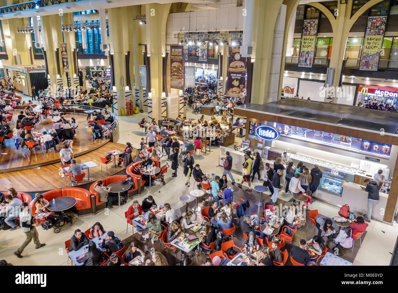 Buenos Aires Argentina,Abasto Shopping Mall,atrium,food court plaza table tables casual dining,crowded,overhead view,families,restaurant restaurants f Stock Photo