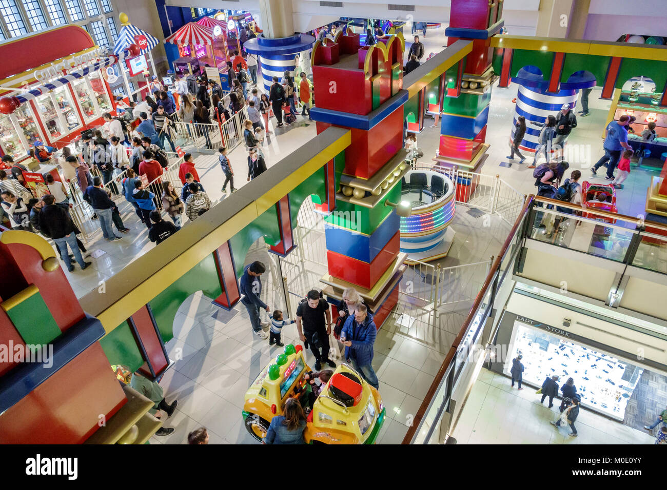 Buenos Aires Argentina,Abasto Shopping Mall,atrium,amusement arcade,rides,games,families,crowded,Hispanic ARG171122060 Stock Photo
