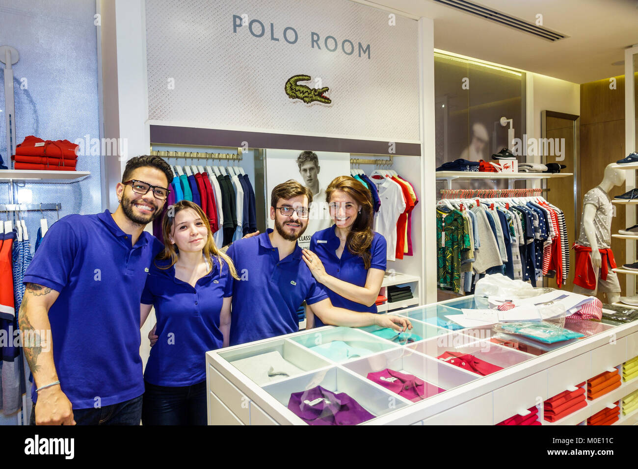 Buenos Aires Argentina,Abasto Shopping Mall,LaCoste,boutique,designer,clothes,employee,boy  boys,male kid kids child children youngster,girl girls,fema Stock Photo -  Alamy