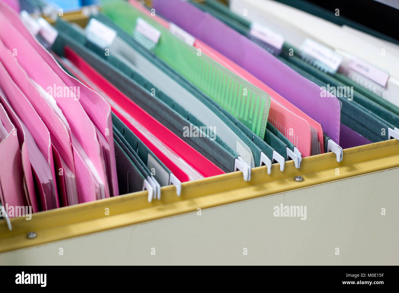 Files document of hanging file folders in a drawer in a whole pile of full papers, at work office Bangkok Thailand Business Concept Stock Photo