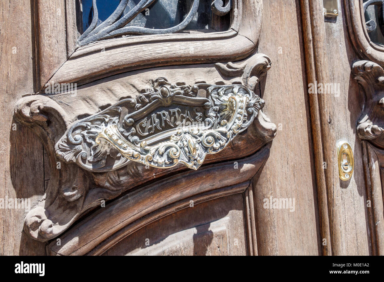 Buenos Aires Argentina,San Telmo,historic center,ornate letter drop,carved wood door,Hispanic ARG171122147 Stock Photo