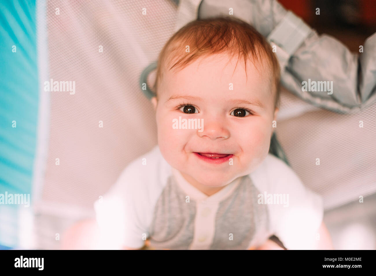 Cute Little Baby Boy Playing In Colorful Playpen Indoors Beautiful