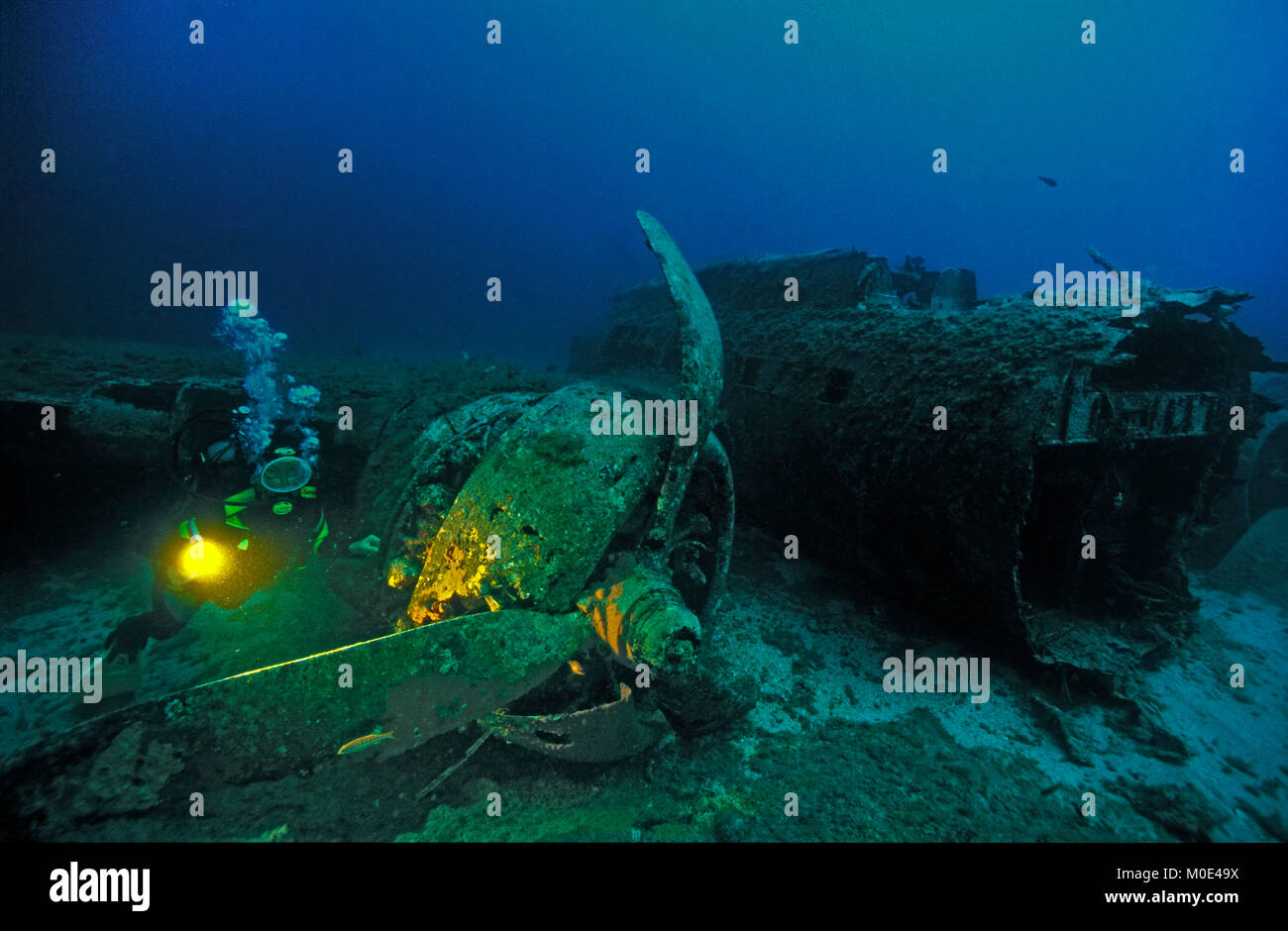 Scuba diver at airplane wreck, North American B 17 Mitchell bomber, crashed at 2nd WW, Calvi, Corse island, France, Mediterranean sea, Europe Stock Photo