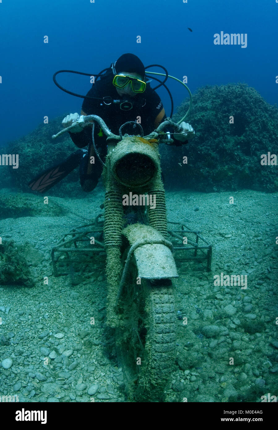 Scuba diver on a sunken motorbike, Zakynthos island,Ionian islands,  Greece, Europe Stock Photo