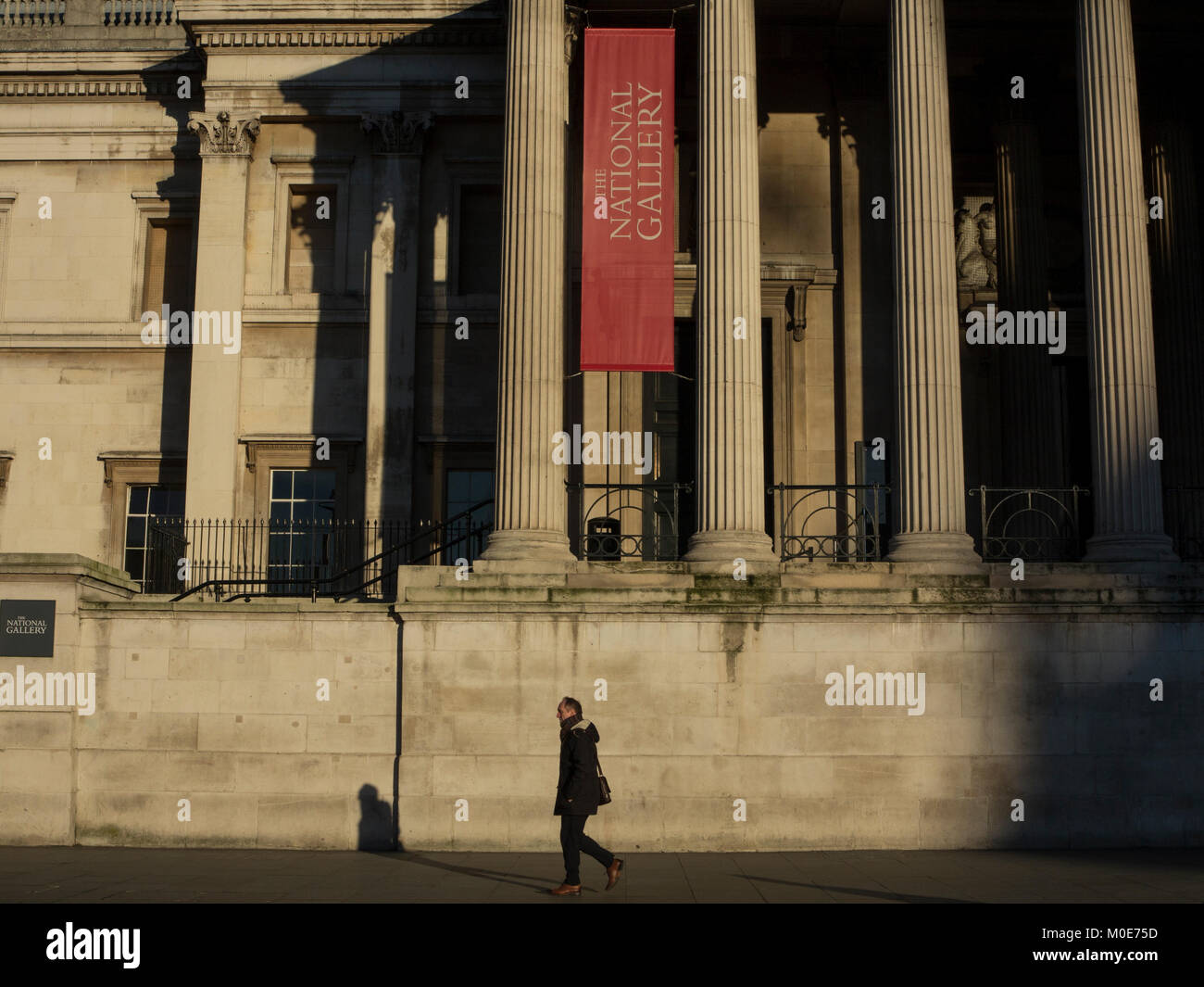 An early morning walk in front of The National Gallery Stock Photo