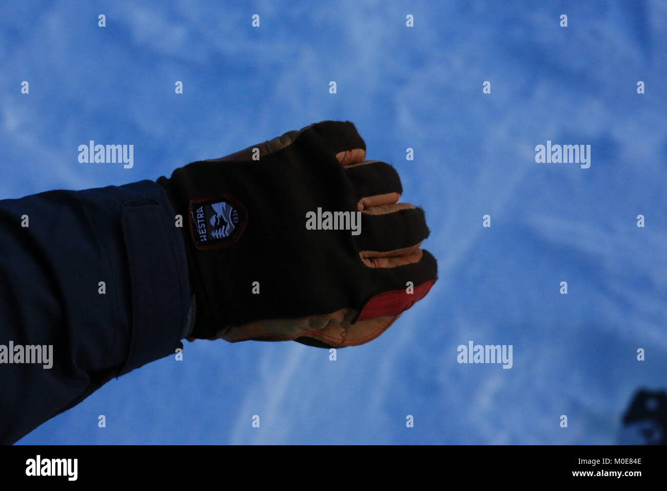 Skiers Hand In Glove, Snow background Stock Photo