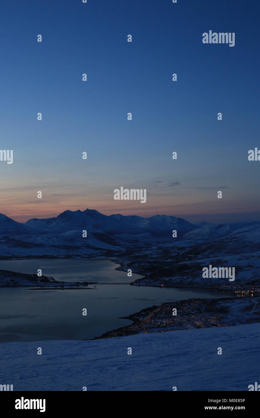 First Glimpse Of Sun In The Mountains Surrounding Tromsø After The Polarnight Stock Photo