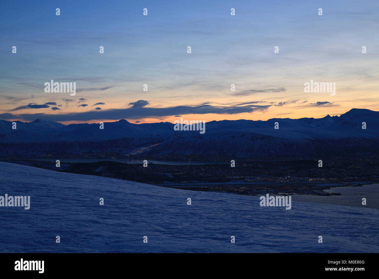 First Glimpse Of Sun In The Mountains Surrounding Tromsø After The Polarnight Stock Photo