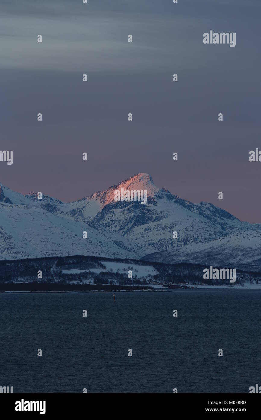 First Glimpse Of Sun In The Mountains Surrounding Tromsø After The Polarnight Stock Photo