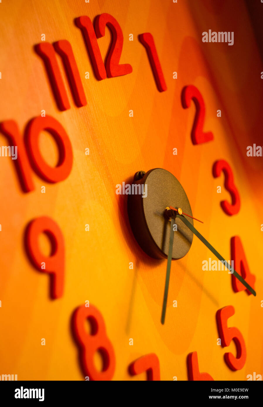 large wall clock with colorful numbers Stock Photo Alamy