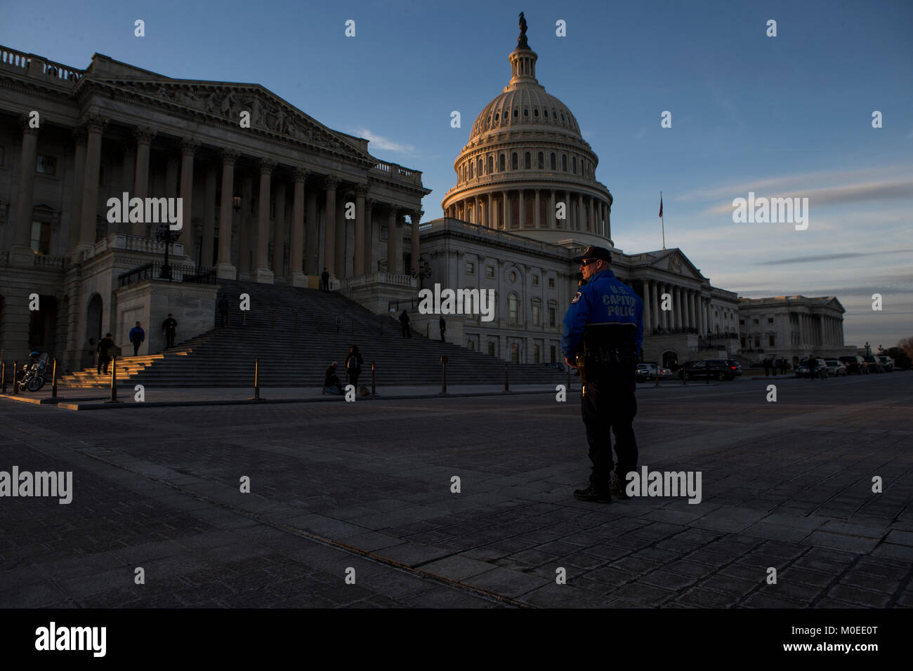 As a police officer stands outside the service hi-res stock photography ...